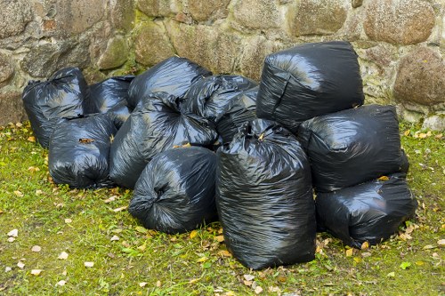 Local gardener clearing waste in a garden